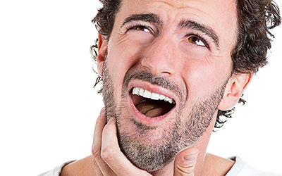 Man with pain in mouth