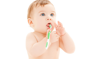 Baby with toothbrush