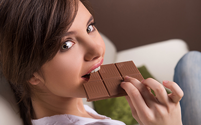 A woman eating chocolate