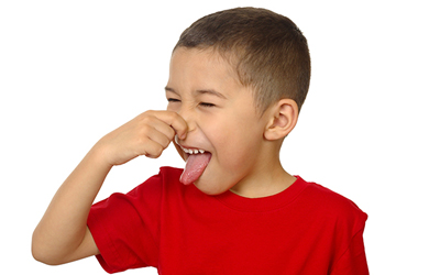 Child holding nose