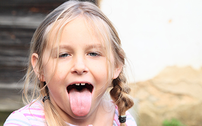A girl sticking her tongue out