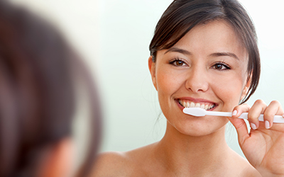 Woman brushing her teeth