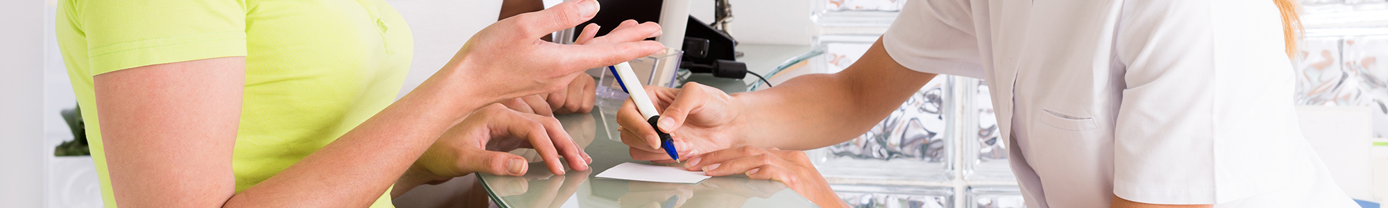 Close up of a healthcare transation showing hands only.