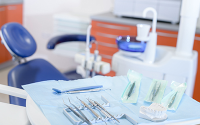 Dental tools on a tray by the dental chair