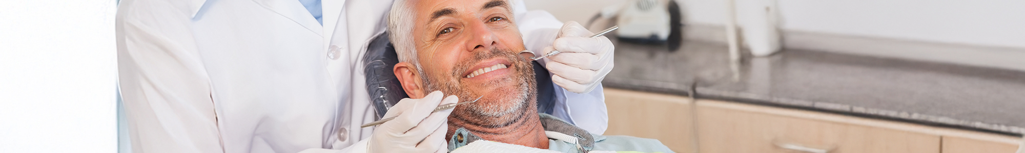 Close up of a handsome mans smile in dental chair