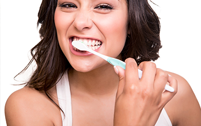 Woman holding tooth brush